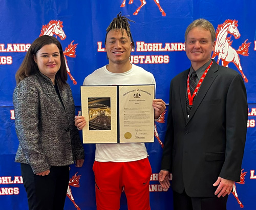 Rep. Charity Grimm Krupa (left) presents a Pennsylvania House of Representatives citation to Rodney Gallagher III (center). Gallagher is a graduating senior at Laurel Highlands High School. John Diamond (right) is the school principal.